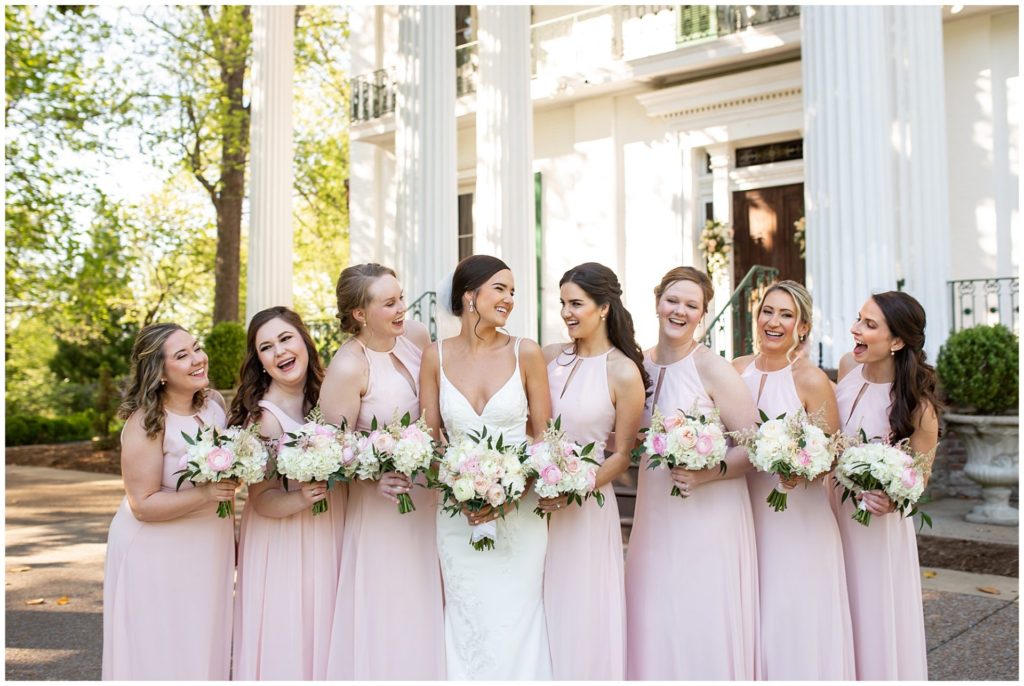 Bridesmaids in pink at Riverwood Mansion in Nashville with the best Nashville Wedding Photographer, Melanie Dunn with gorgeous white and pink floral bouquets 