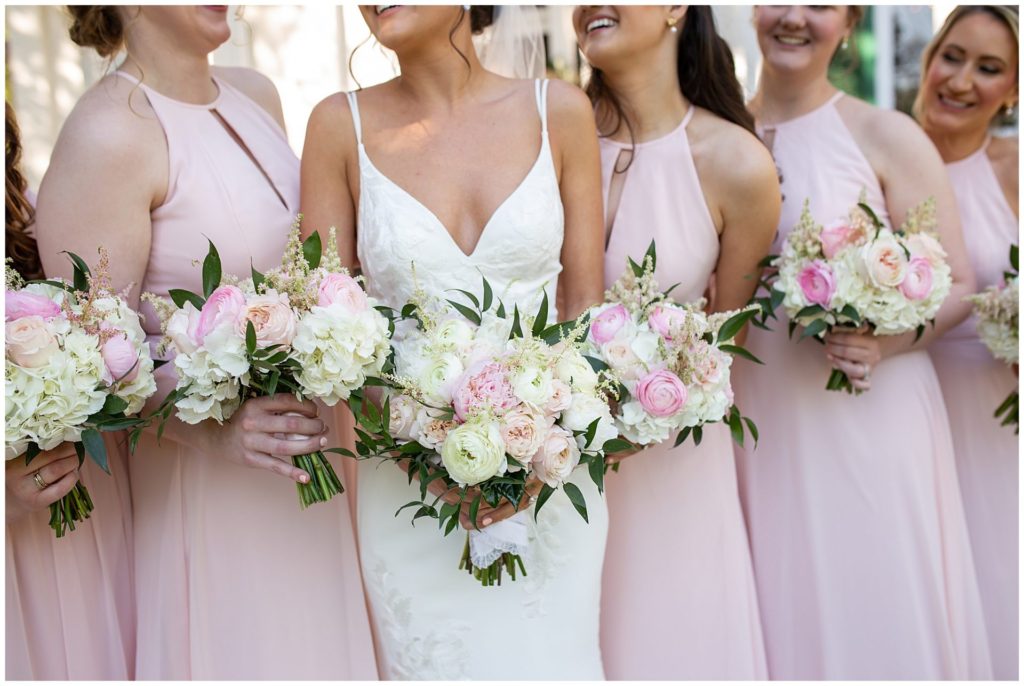 Bridesmaids in pink at Riverwood Mansion in Nashville with the best Nashville Wedding Photographer, Melanie Dunn